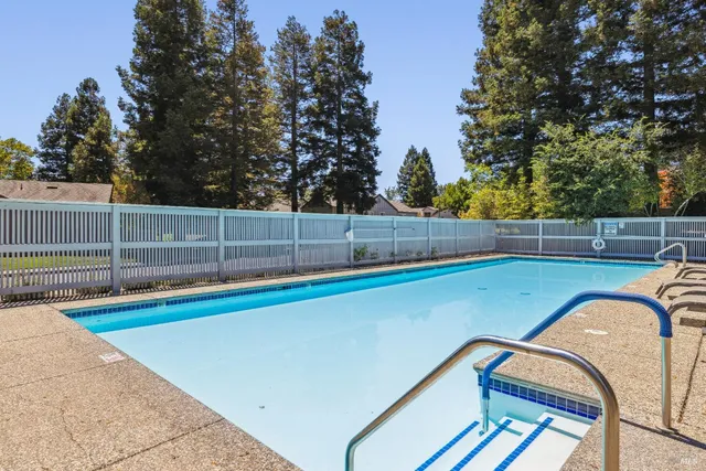a view of a swimming pool with a patio