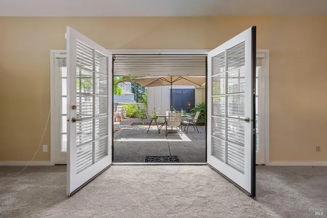 a view of a livingroom with furniture and a window