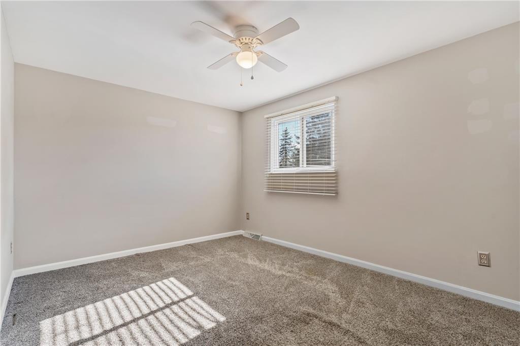 1015 1st Street McKees Rocks, PA 15136 - Photo 16 of 22 an empty room with windows and fan