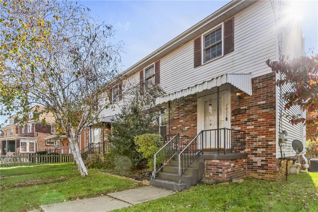 1015 1st Street McKees Rocks, PA 15136 - Photo 2 of 22 front view of a house with a yard