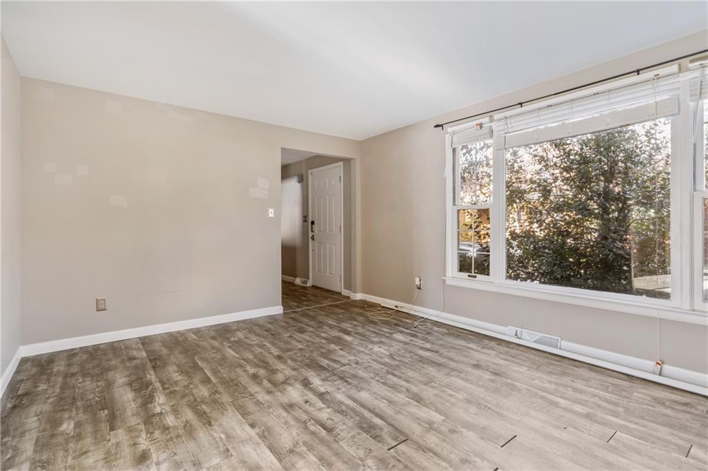 1015 1st Street McKees Rocks, PA 15136 - Photo 3 of 22 a view of an empty room with a window