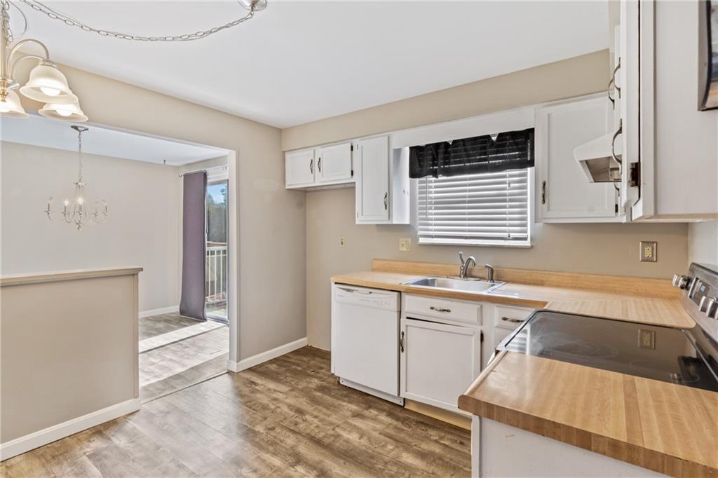 1015 1st Street McKees Rocks, PA 15136 - Photo 6 of 22 a kitchen with a sink cabinets and window