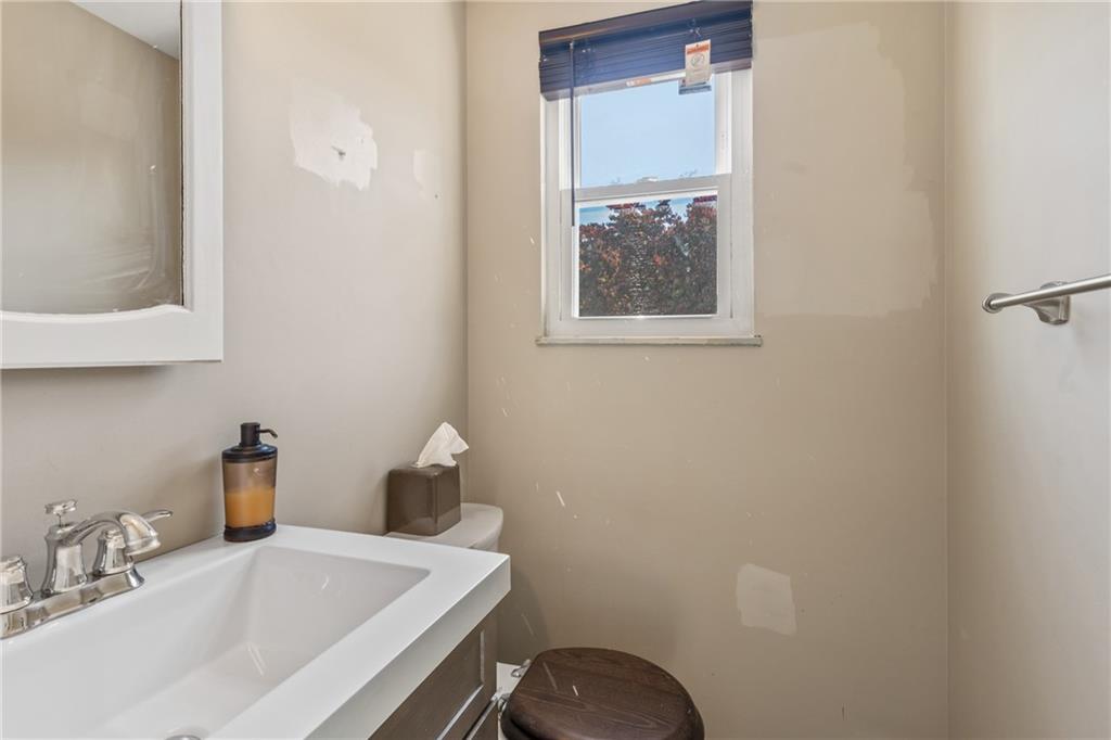 1015 1st Street McKees Rocks, PA 15136 - Photo 8 of 22 a bathroom with a sink and a toilet