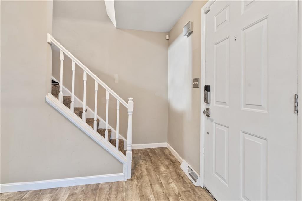 1015 1st Street McKees Rocks, PA 15136 - Photo 10 of 22 a view of an entryway with wooden floor