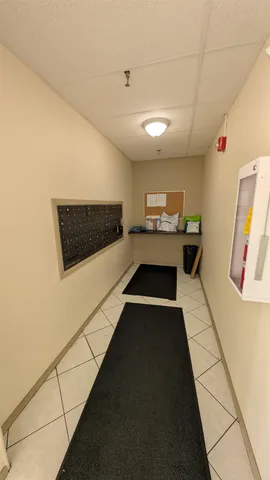 a kitchen with stainless steel appliances a stove a microwave and white cabinets