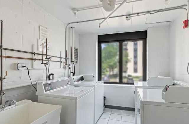 a view of a patio with dining table and chairs with wooden floor