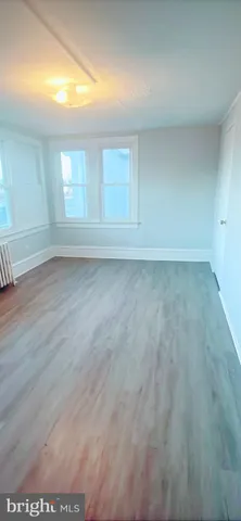 a large kitchen with cabinets and a couch