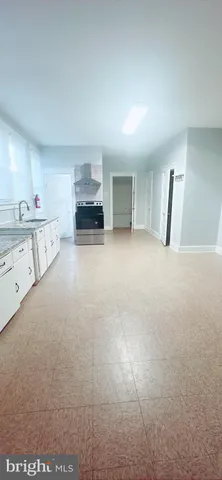 a view of living room filled with furniture