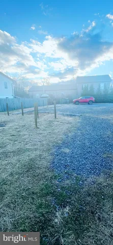 a view of a big room with windows and cabinet