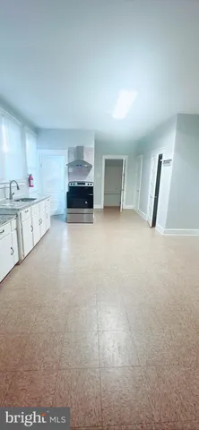 a view of a kitchen with furniture and cabinets
