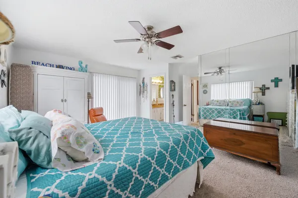 a bed room with a bed and a window