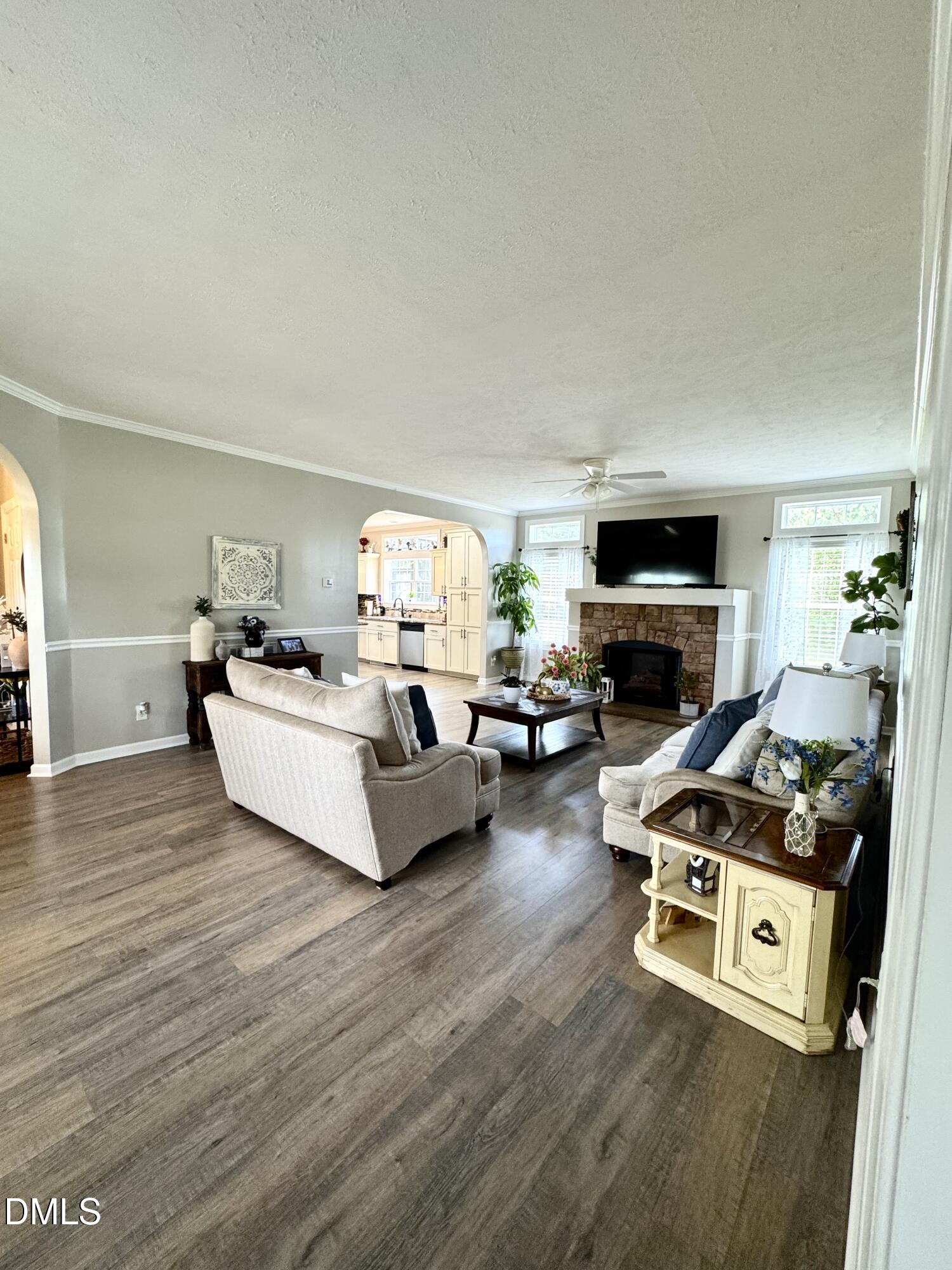640 Tart Town Road Dunn, NC 28334 - Photo 10 of 71 a living room with furniture a fireplace and a flat screen tv