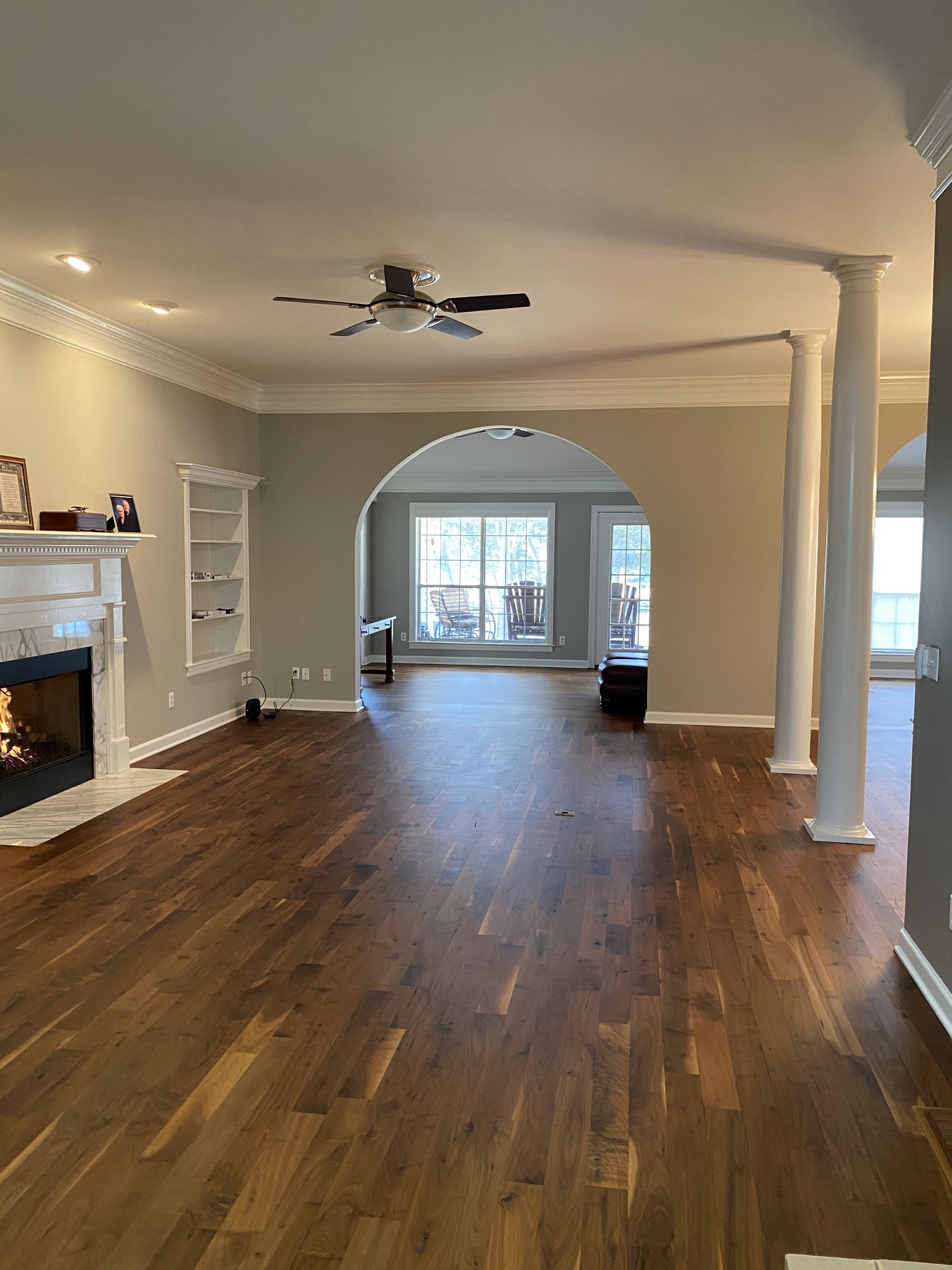 1045 Edgewater Circle Gallatin, TN 37066 - Photo 6 of 10 an empty room with wooden floor and fireplace