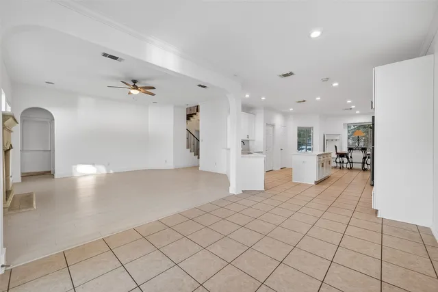 a view of a living room and kitchen with furniture