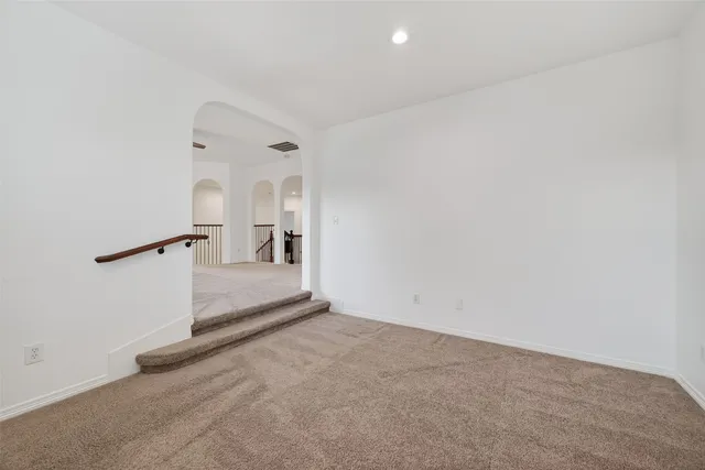 a view of a hallway with a white walls