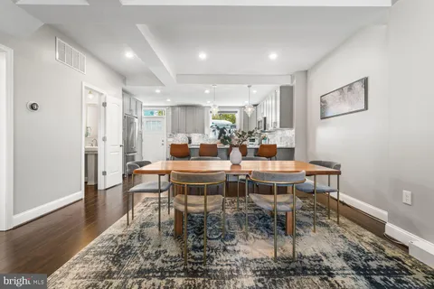 a dining room with a table and chairs