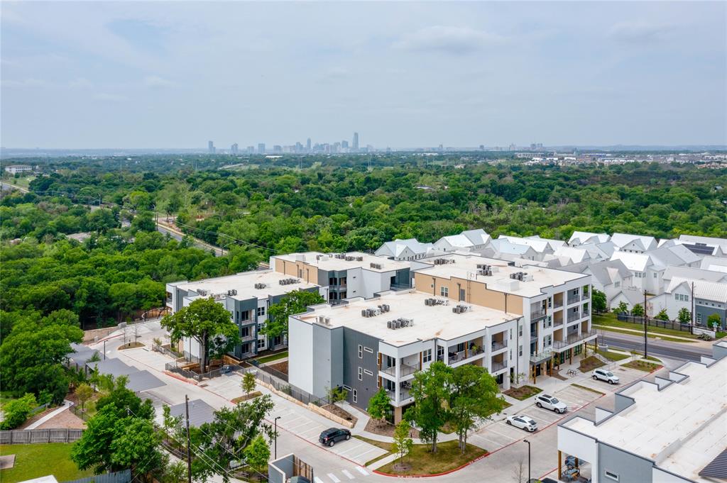 4801 Springdale Road, Unit 1307 Austin, TX 78723 - Photo 18 of 30 an aerial view of a multi story residential apartment building with a yard