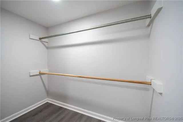 a view of an empty walk in closet