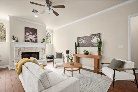 a living room with furniture and a fireplace
