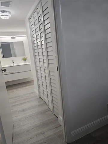 a view of entryway with wooden floor