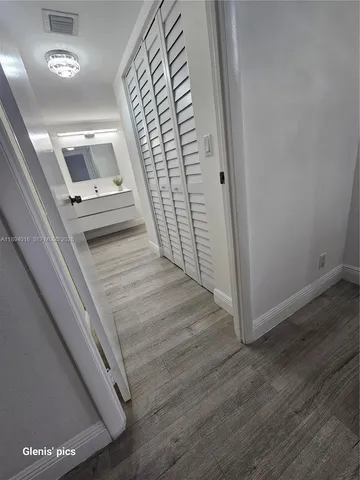 a bathroom with a sink toilet and mirror