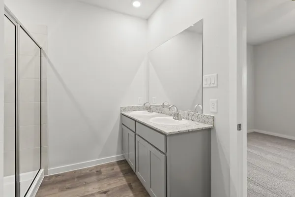 a bathroom with a sink and a mirror