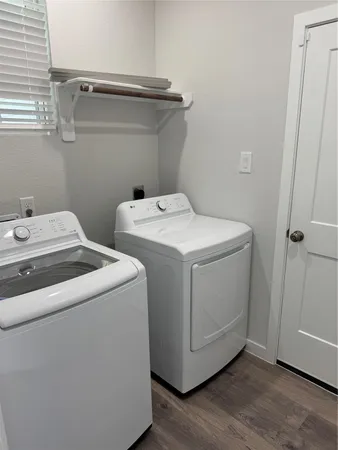 a utility room with dryer and washer
