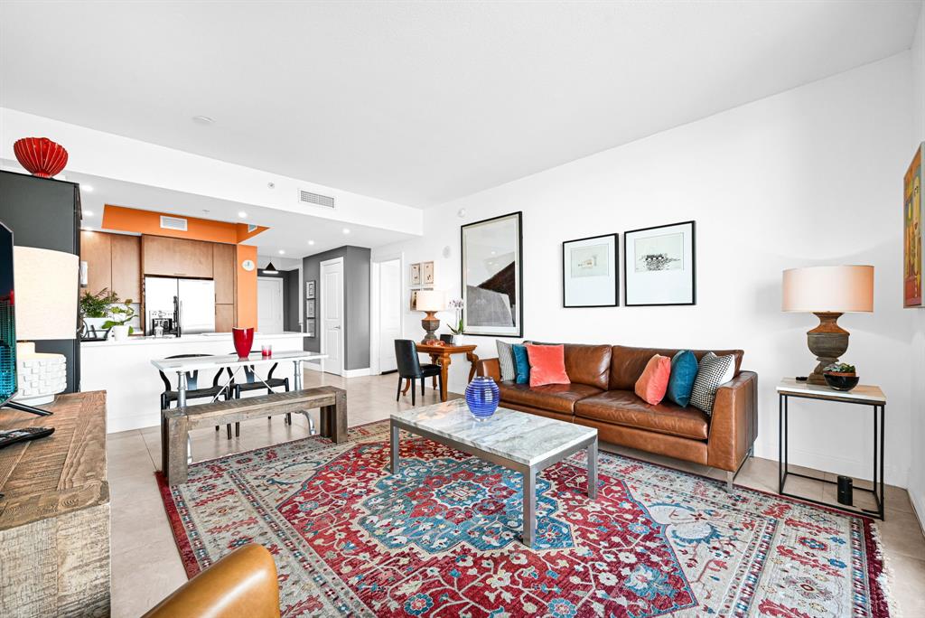 315 Northeast 3rd Avenue, Unit 1008 Fort Lauderdale, FL 33301 - Photo 12 of 52 a living room with furniture a rug and a lamp