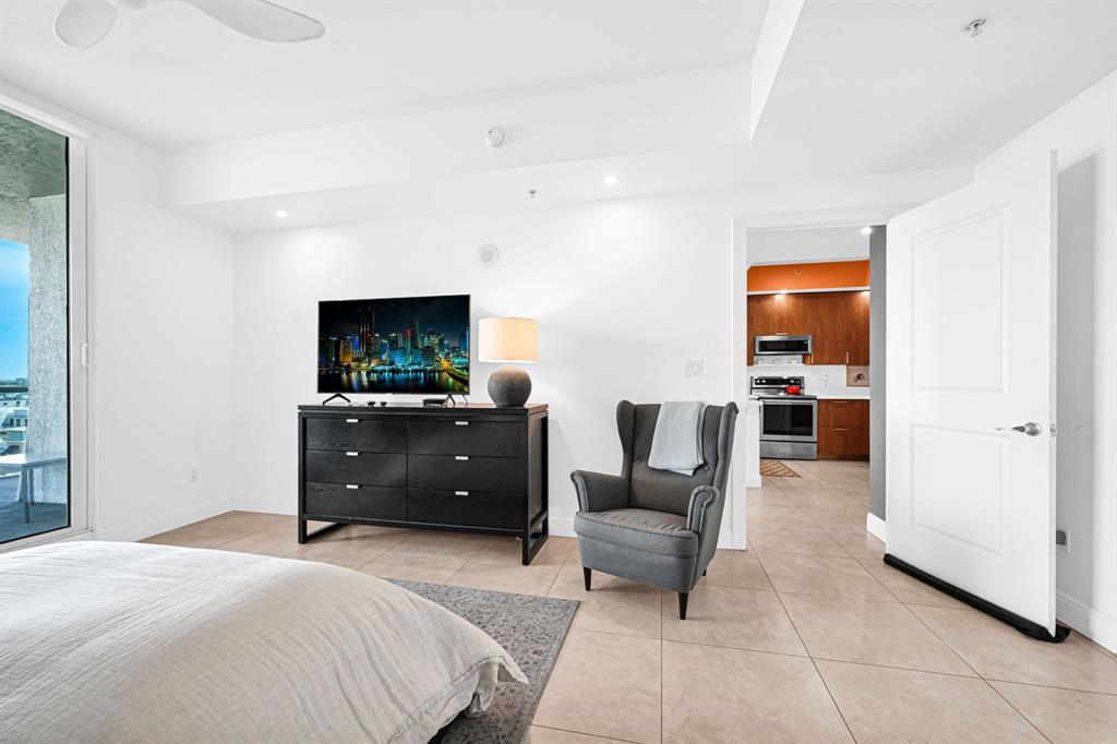315 Northeast 3rd Avenue, Unit 1008 Fort Lauderdale, FL 33301 - Photo 20 of 52 a bedroom with a bed and a television