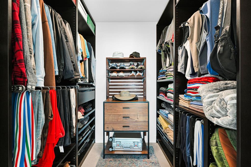 315 Northeast 3rd Avenue, Unit 1008 Fort Lauderdale, FL 33301 - Photo 21 of 52 a view of walk in closet with clothes and shoes
