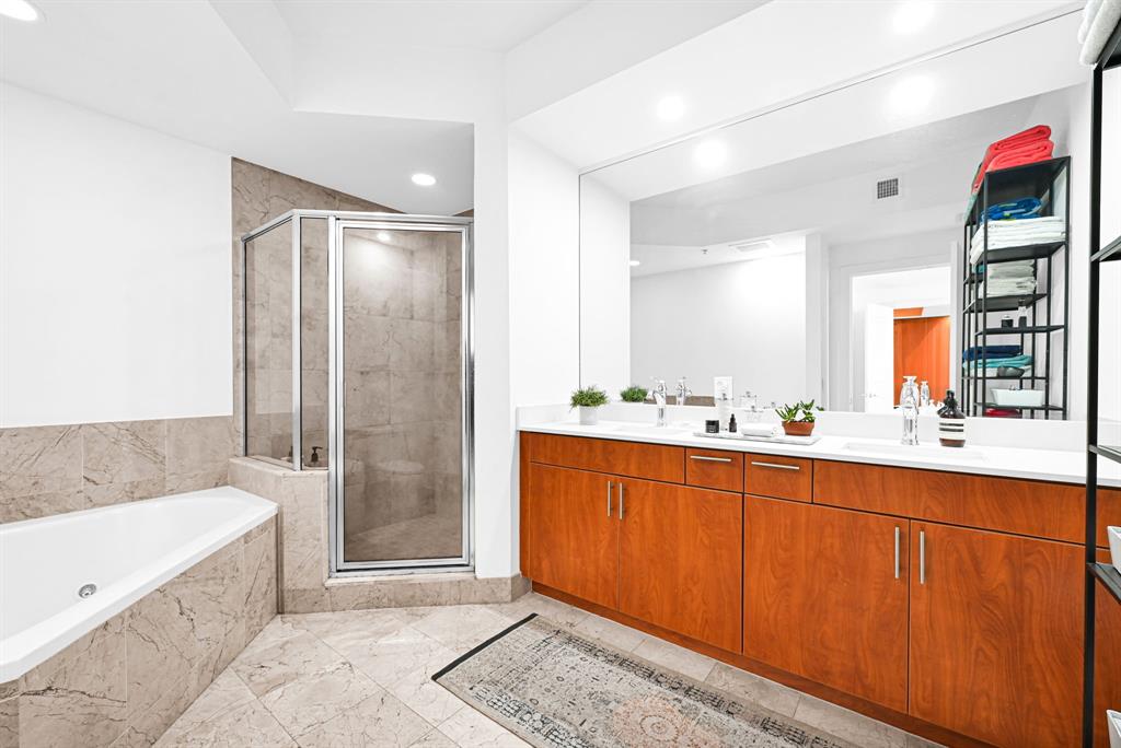 315 Northeast 3rd Avenue, Unit 1008 Fort Lauderdale, FL 33301 - Photo 22 of 52 a spacious bathroom with a tub shower and sink