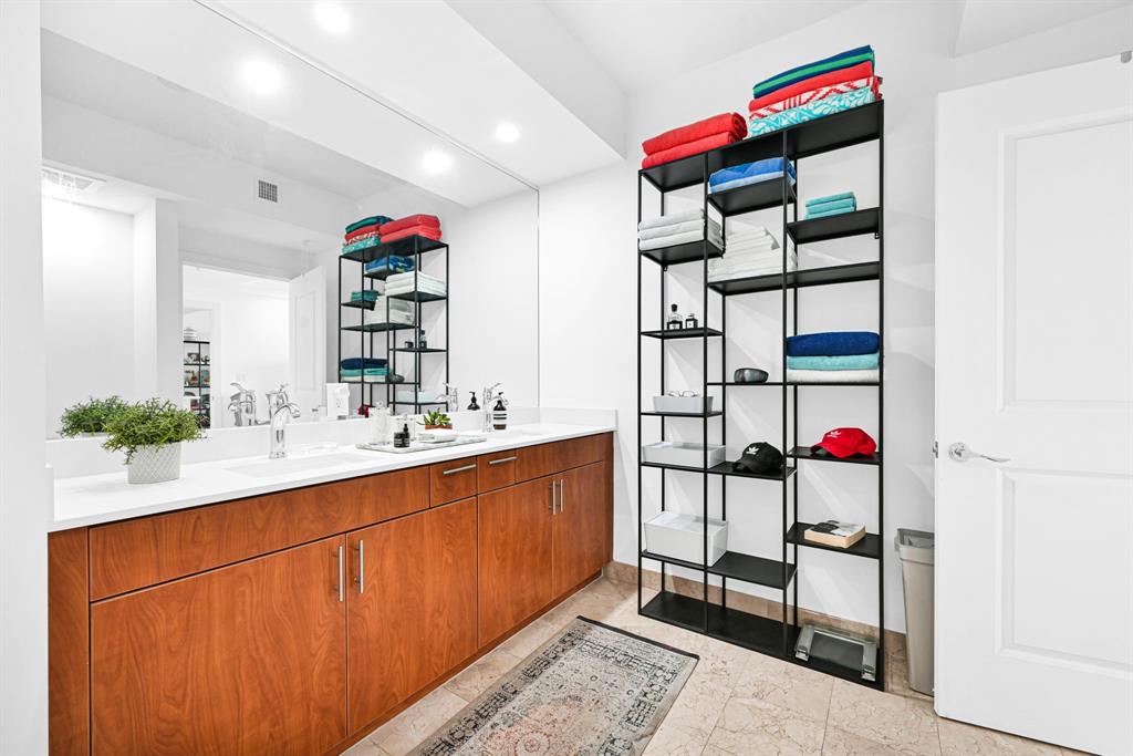 315 Northeast 3rd Avenue, Unit 1008 Fort Lauderdale, FL 33301 - Photo 23 of 52 a bathroom with a sink and a mirror