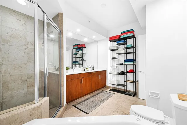 a view of a bathroom with a glass door shower