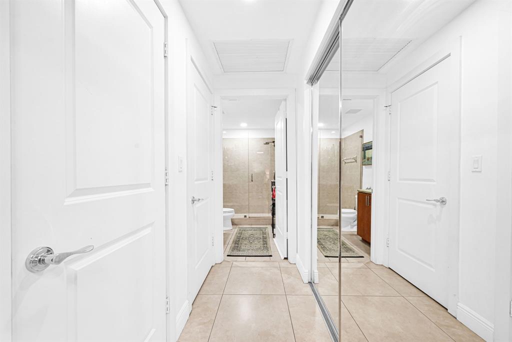 315 Northeast 3rd Avenue, Unit 1008 Fort Lauderdale, FL 33301 - Photo 25 of 52 a view of a bathroom with a glass door shower
