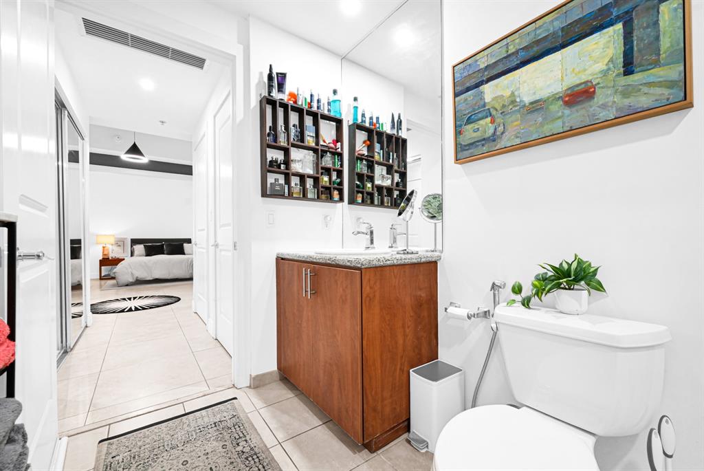 315 Northeast 3rd Avenue, Unit 1008 Fort Lauderdale, FL 33301 - Photo 27 of 52 a bathroom with a sink a toilet and shower