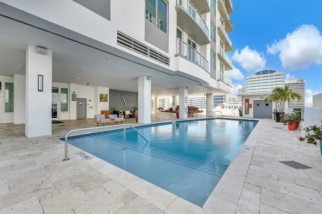 a view of a swimming pool with a lounge chairs