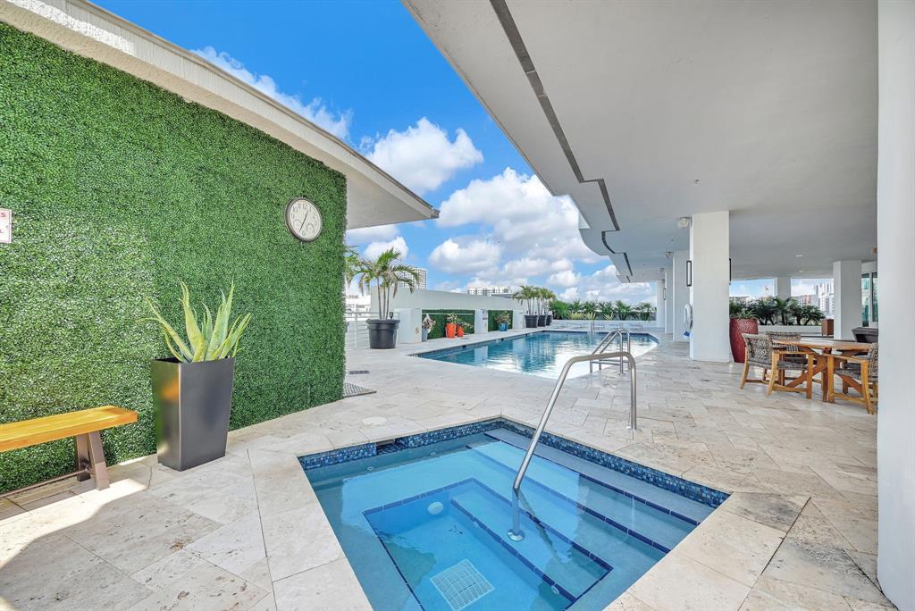 315 Northeast 3rd Avenue, Unit 1008 Fort Lauderdale, FL 33301 - Photo 40 of 52 a view of a swimming pool with a patio