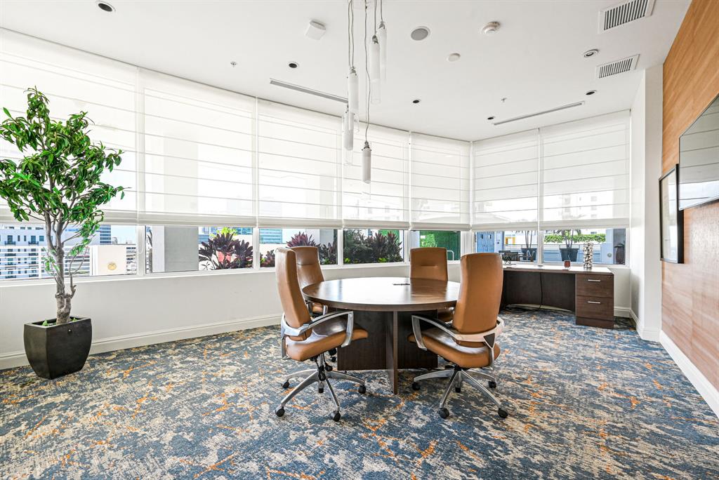 315 Northeast 3rd Avenue, Unit 1008 Fort Lauderdale, FL 33301 - Photo 43 of 52 a work room with furniture and a potted plant