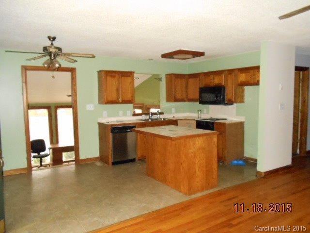 580 Manchester Road Mount Gilead, NC 27306 - Photo 2 of 13 a kitchen with a sink appliances and cabinets