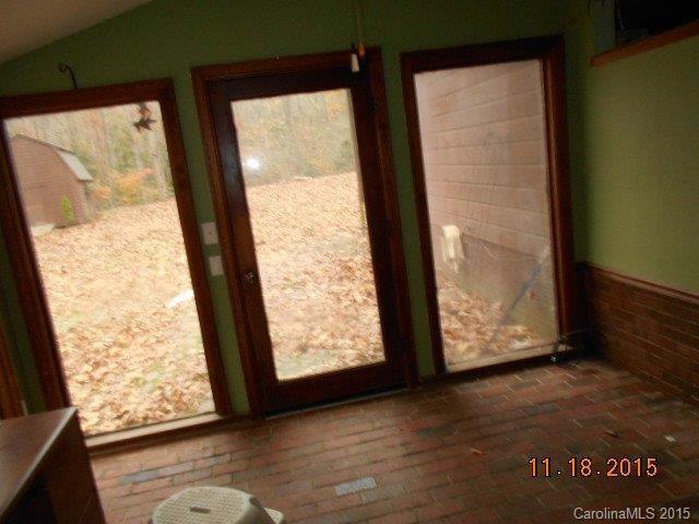 580 Manchester Road Mount Gilead, NC 27306 - Photo 4 of 13 a view of an empty room with wooden floor and a window