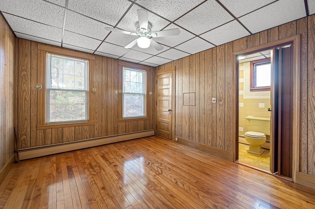 24 Second Street Worcester, MA 01602 - Photo 12 of 42 an empty room with wooden floor and windows