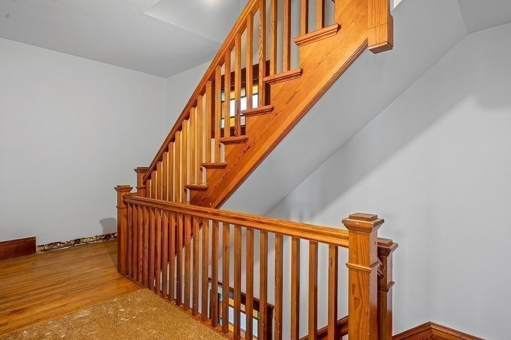 24 Second Street Worcester, MA 01602 - Photo 21 of 42 a view of staircase with railing and white walls
