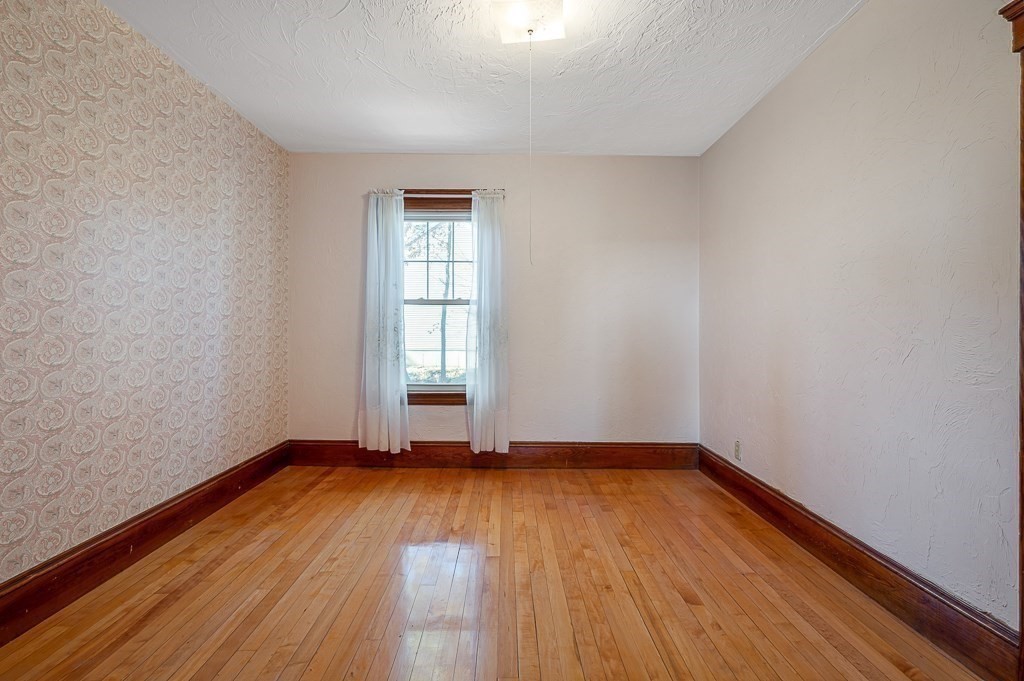 24 Second Street Worcester, MA 01602 - Photo 24 of 42 a view of empty room with wooden floor and fan