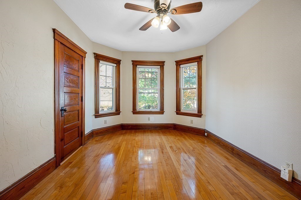 24 Second Street Worcester, MA 01602 - Photo 25 of 42 a view of an empty room with wooden floor and a window