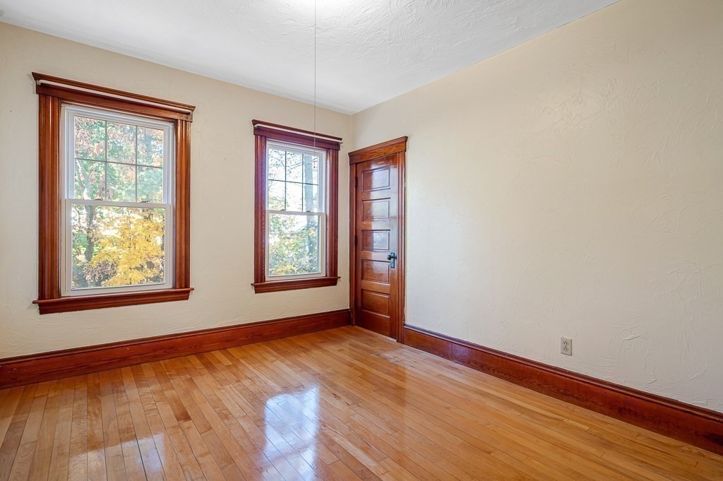 24 Second Street Worcester, MA 01602 - Photo 26 of 42 a view of an empty room with wooden floor and a window