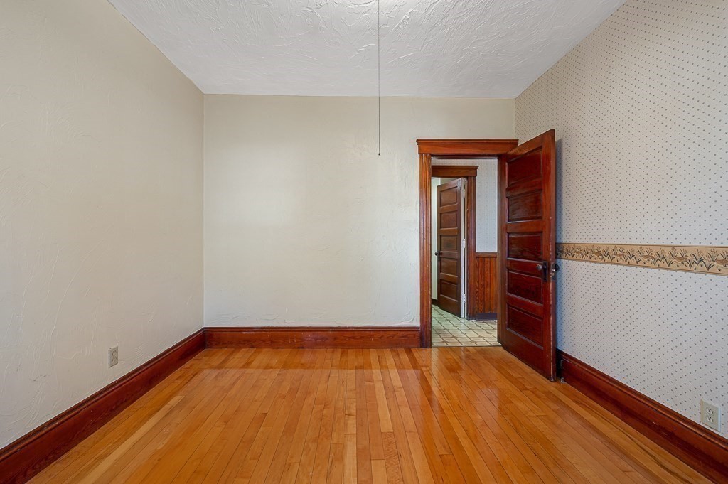 24 Second Street Worcester, MA 01602 - Photo 27 of 42 a view of a room with wooden floor and white walls