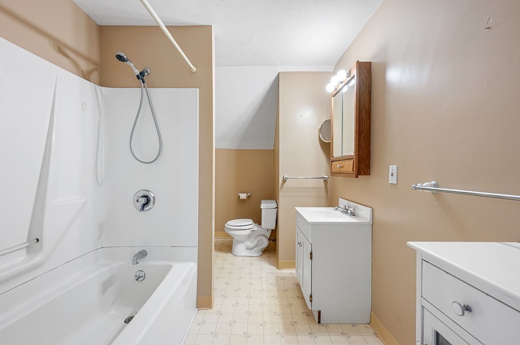 24 Second Street Worcester, MA 01602 - Photo 31 of 42 a bathroom with a tub sink and mirror