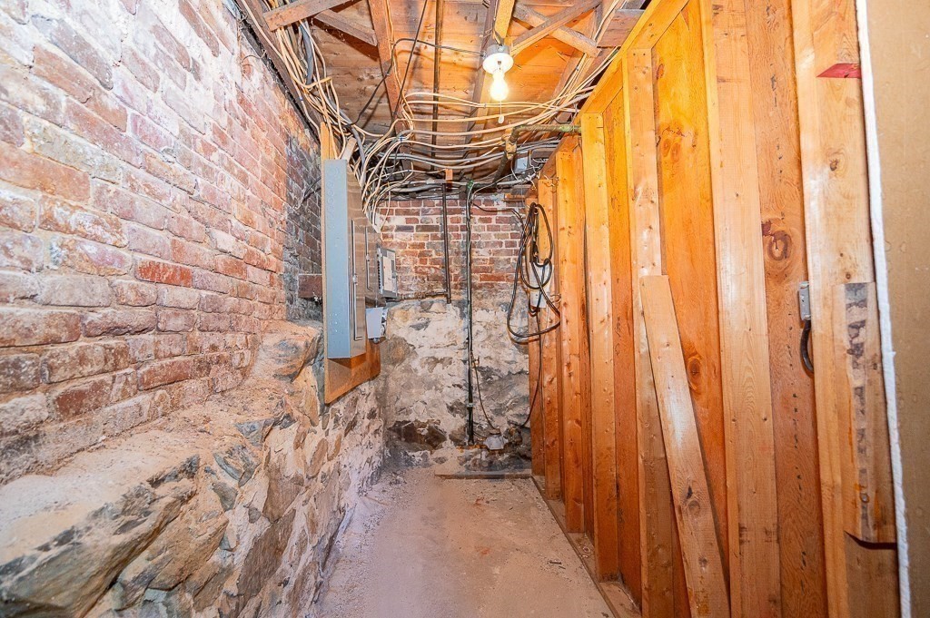 24 Second Street Worcester, MA 01602 - Photo 39 of 42 a backyard of a house with a fountain and outdoor seating