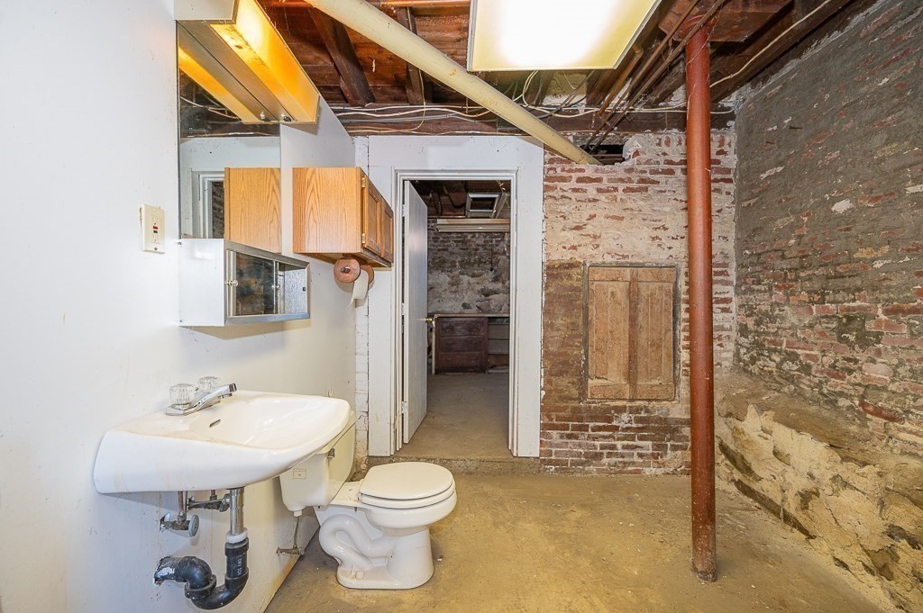 24 Second Street Worcester, MA 01602 - Photo 42 of 42 a bathroom with a sink a toilet and shower