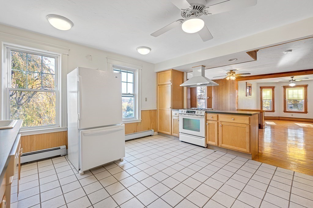 24 Second Street Worcester, MA 01602 - Photo 10 of 42 a kitchen with white cabinets and white appliances
